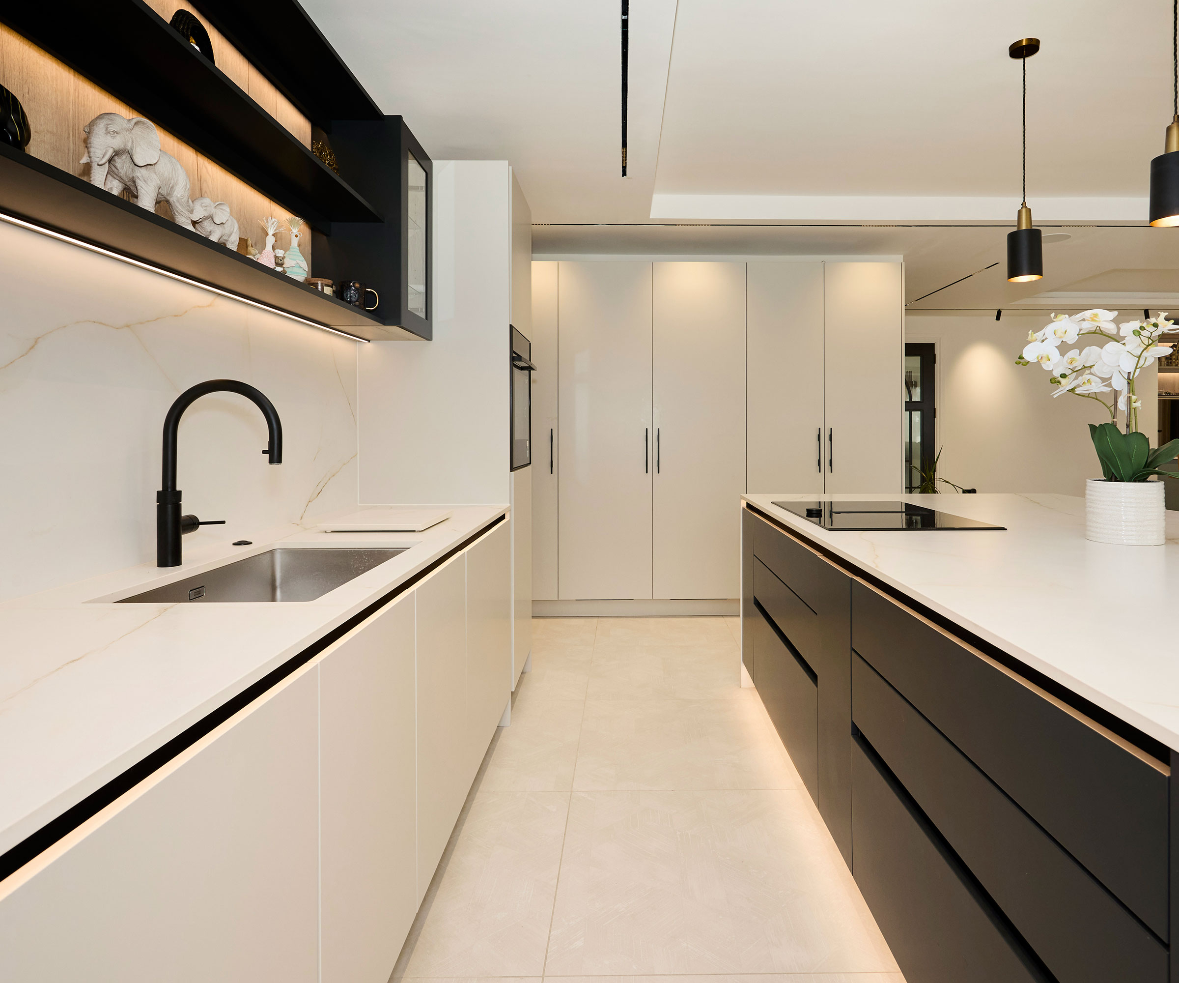 modern black and white kitchen with handleless cabinets