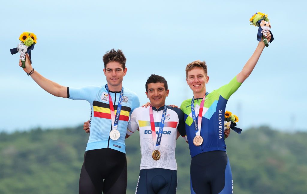 OYAMA JAPAN JULY 24 LR Silver medalist Wout van Aert of Team Belgium gold medalist Richard Carapaz of Team Ecuador and bronze medalist Tadej Pogacar of Team Slovenia pose on the podium during the medal ceremony during the Mens road race at the Fuji International Speedway on day one of the Tokyo 2020 Olympic Games on July 24 2021 in Oyama Shizuoka Japan Photo by Michael SteeleGetty Images