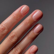 A clear, slightly shimmery manicure