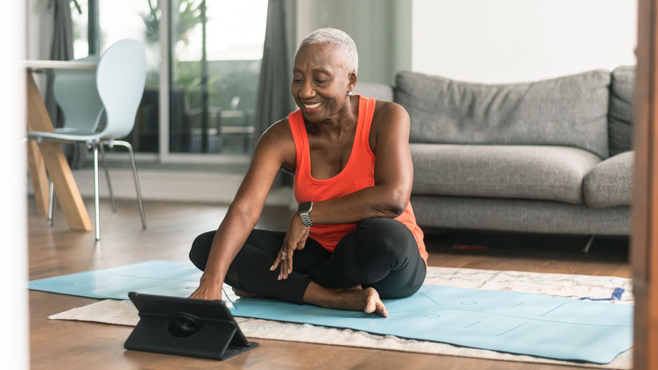 Woman exercising with Youtube weight loss workout