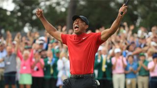 Tiger Woods celebrates on the 18th at Augusta National after winning the 2019 Masters