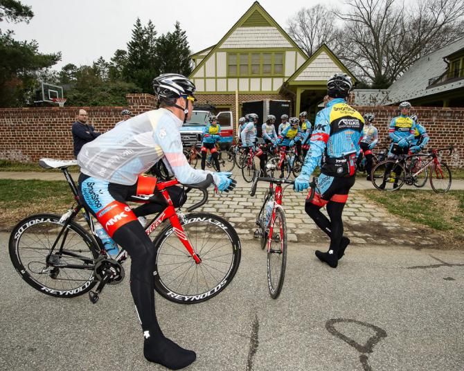 Riders discuss the day's upcoming training ride at the Team SmartStop p/b Mountain Khakis camp.
