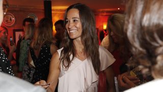 Pippa Middleton smiles, with her bag under her arm, attends The Miles Frost Fund party at Bunga Bunga Covent Garden on June 27, 2017