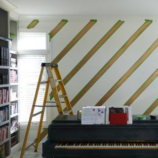 living room with piano and ladder