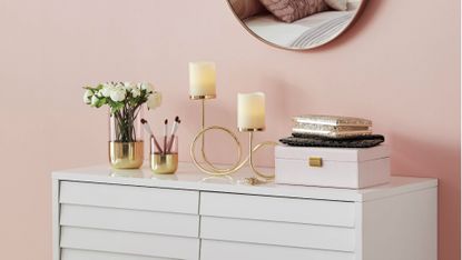 jewellery storage: pink jewellery box on a dresser