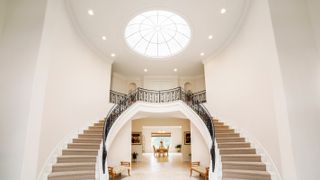 double staircase with glass domed ceiling
