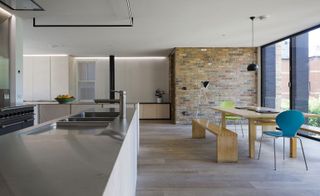 Kitchen & dining area with exposed brick