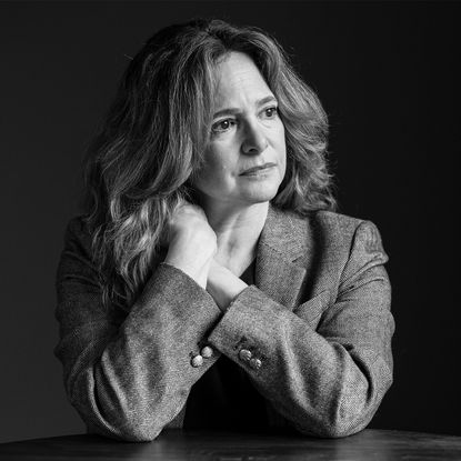 a woman wearing a blazer