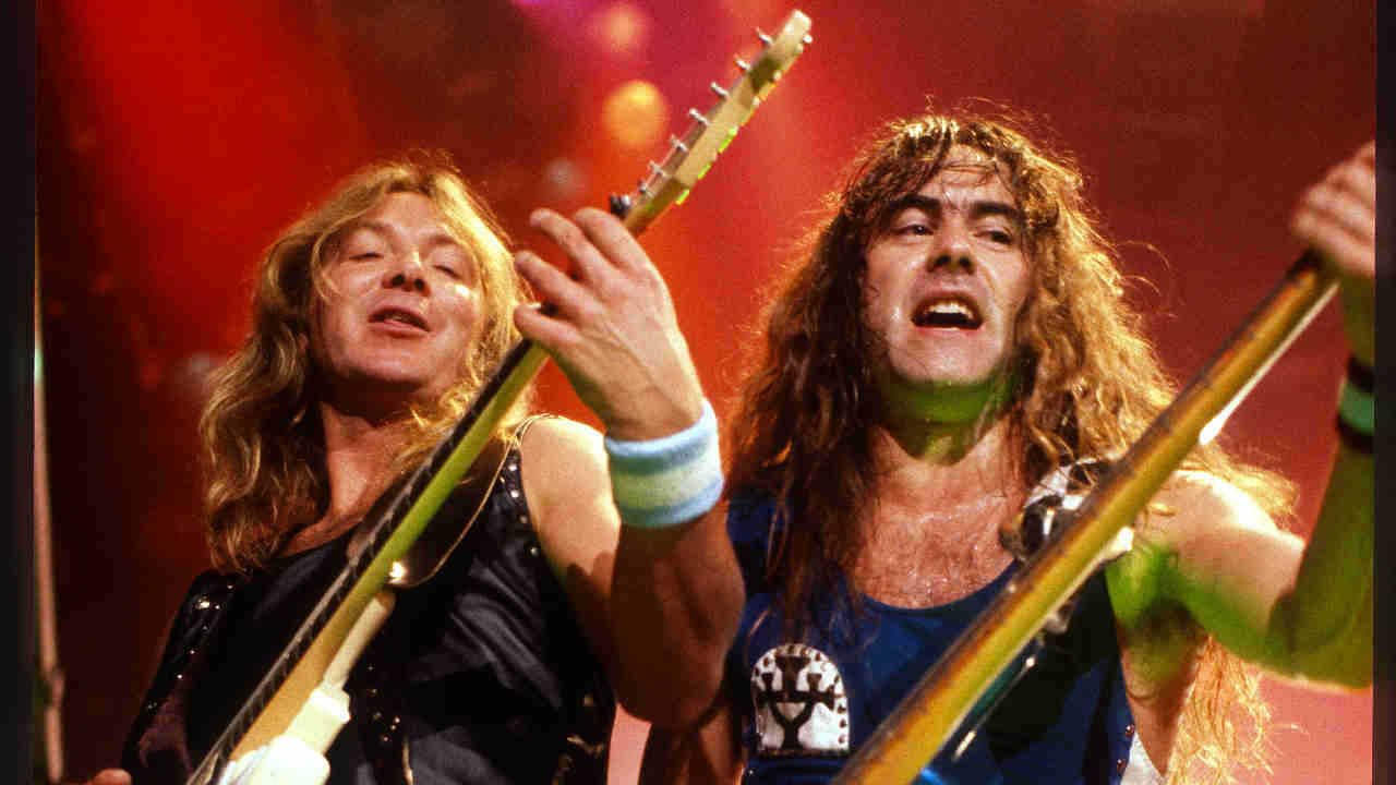 Iron Maiden performing onstage in 1988