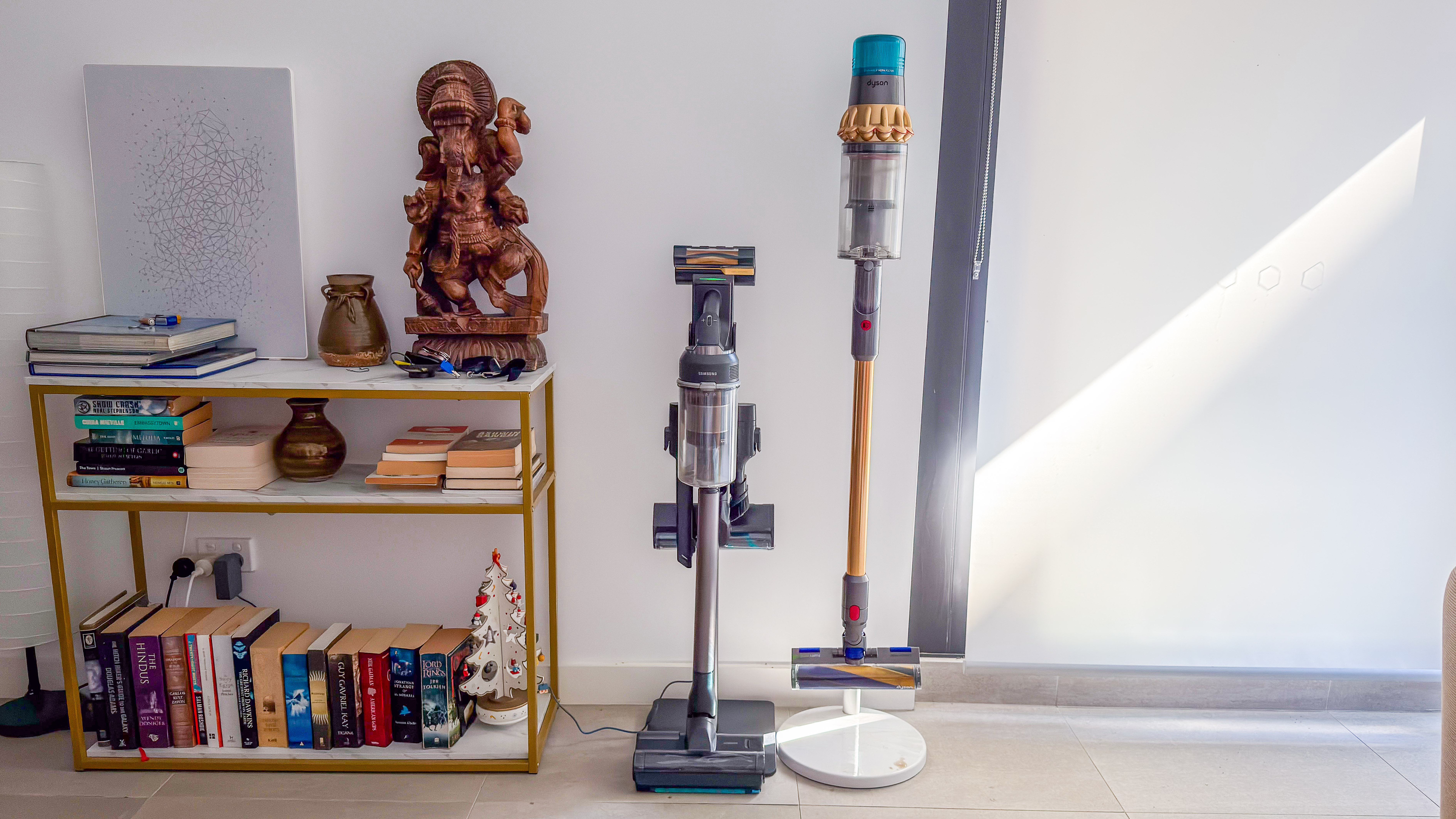 Samsung Jet 95S on its stand beside the Dyson V15 Detect Submarine