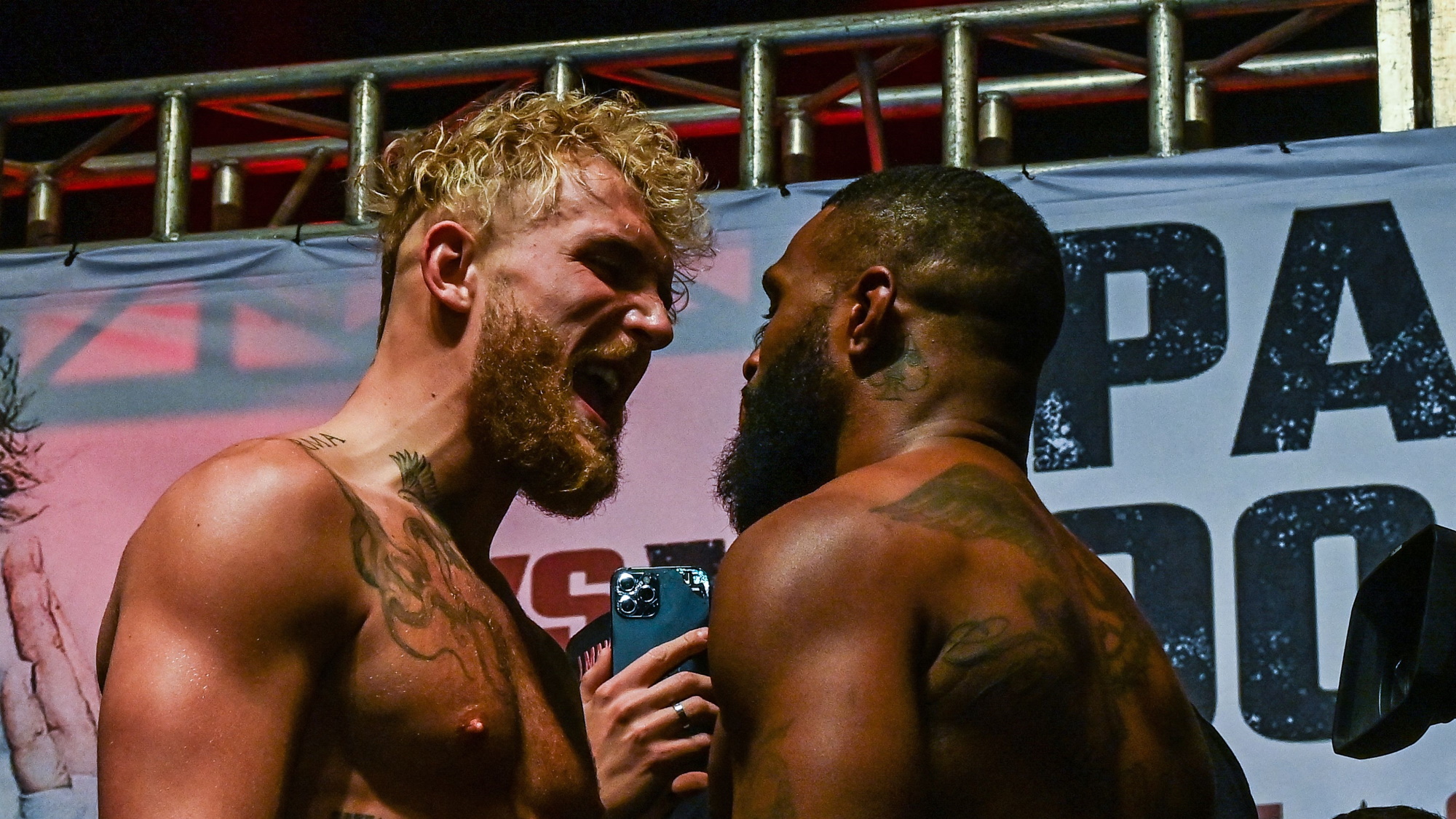 Jake Paul and Tyron Woodley facing off ahead of their boxing rematch