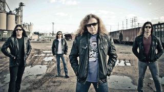 Megadeth posing for a photograph in 2013