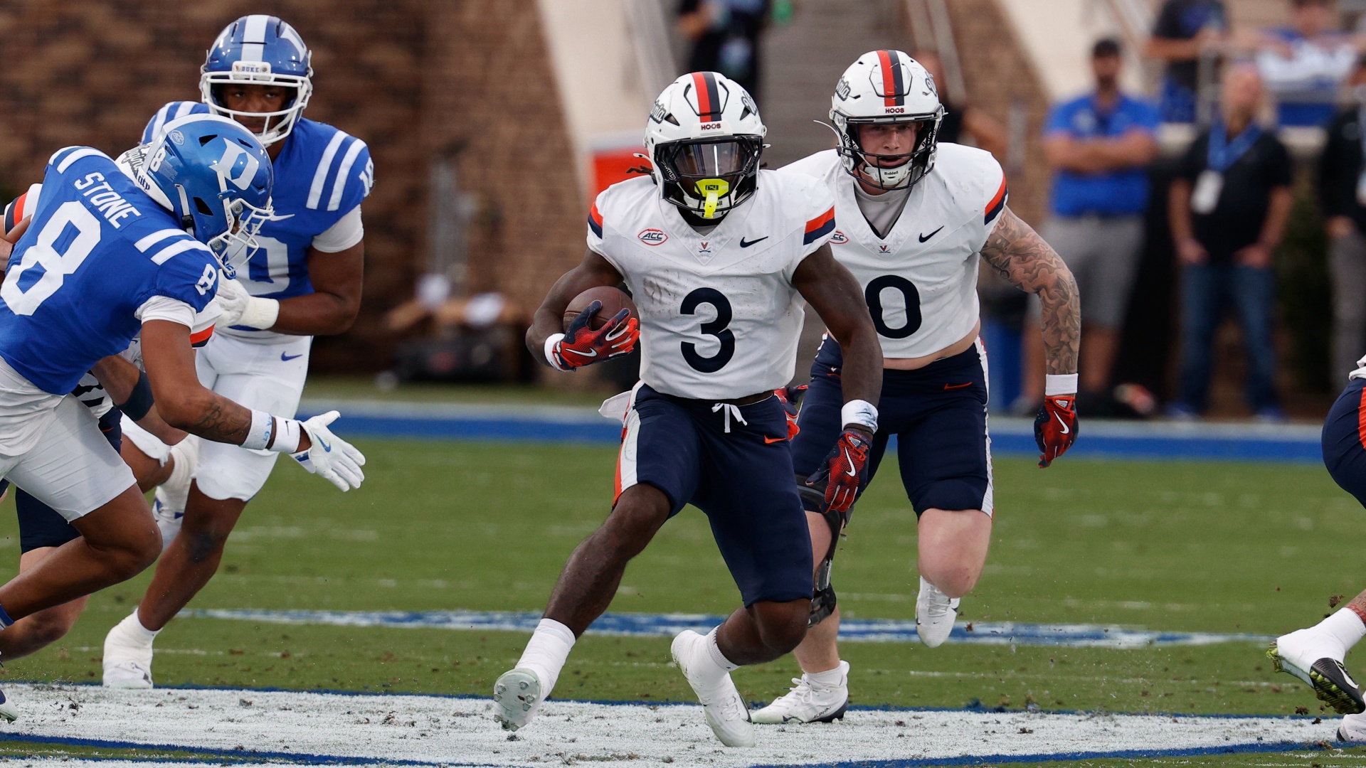 J&#039;Mari Taylor #3 of the Virginia Cavaliers running with the ball against the Duke Blue Devils in a rehearsal for the ACC Championship Game
