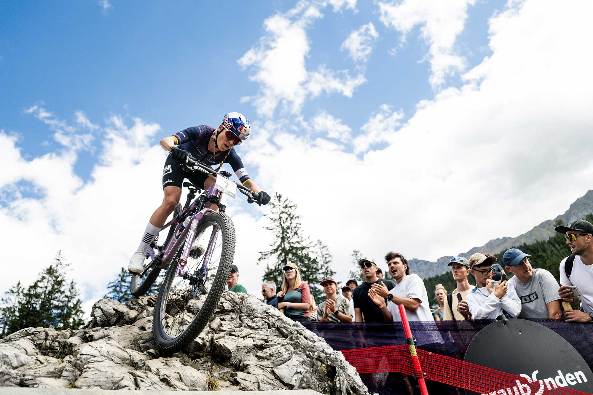 Kate Courtney descends during the UCI Mountain Bike World Series XCO race in Lenzerheide