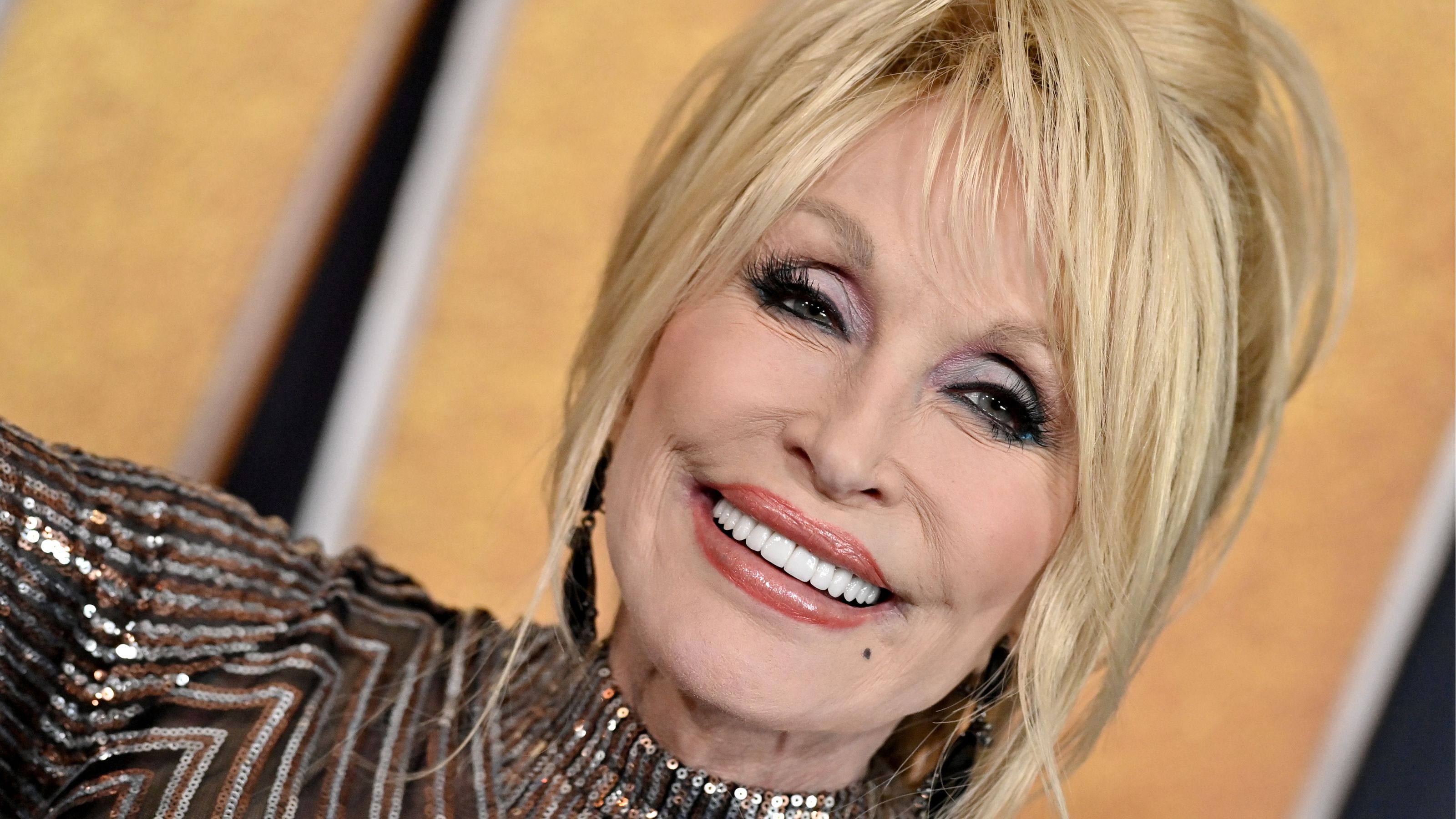 dolly parton on a yellow background