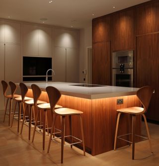 a kitchen island with led strip lighting