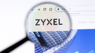 The Zyxel company logo as seen on its website through a magnifying glass
