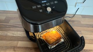 Pork belly being cooked in the Instant Vortex Plus 6-in-1 air fryer with ClearCook and OdourEase
