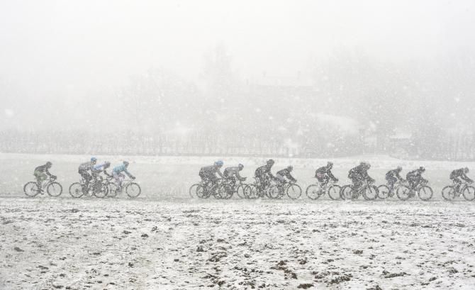 The peloton battle the snow at the Giro d'Italia