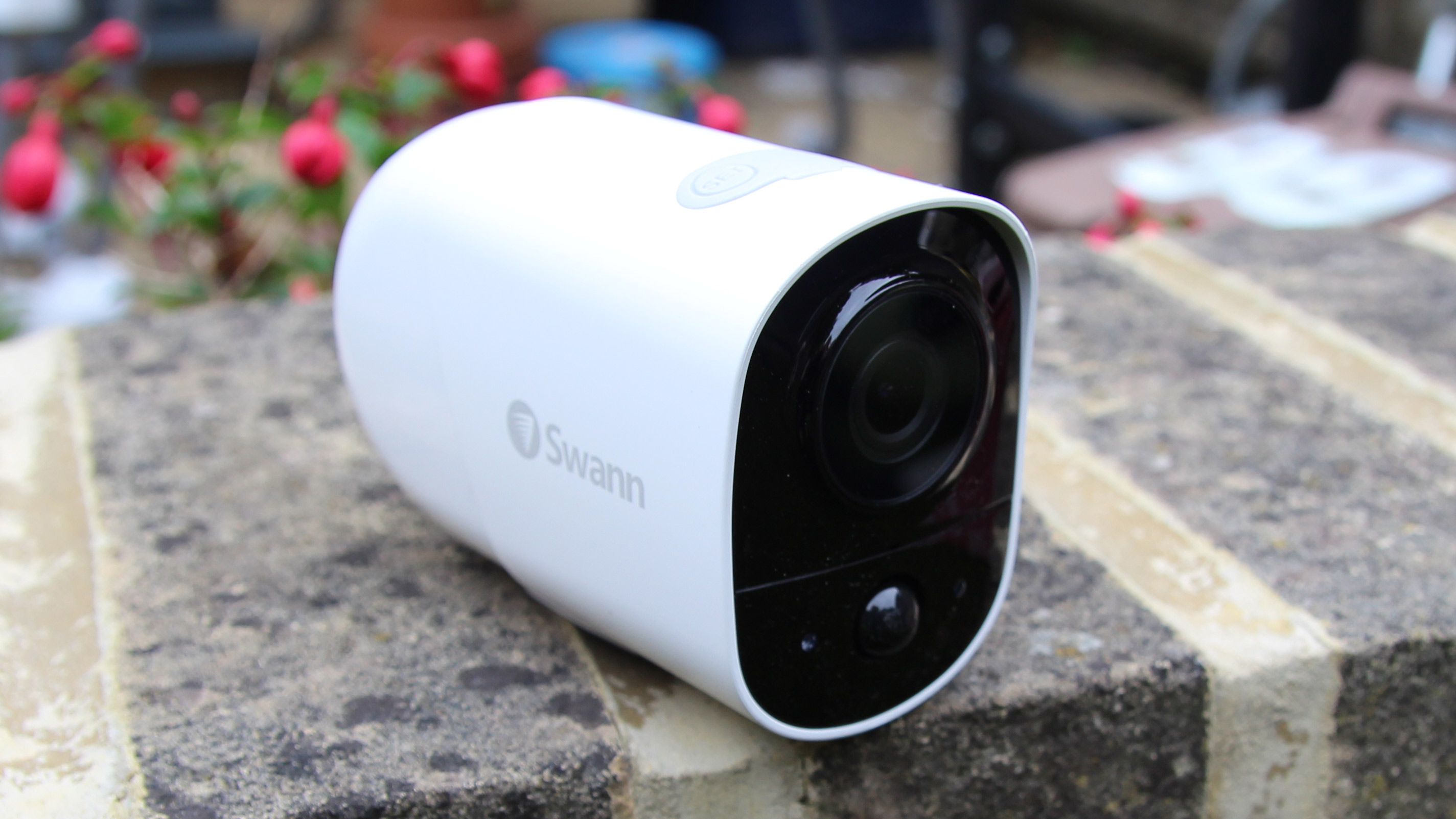 The Swann Xtreem security camera resting on a wall outside