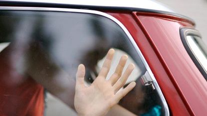 couple kissing in a car