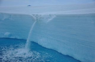 Meltwater waterfall at the Larsen A. ice shelf edge.