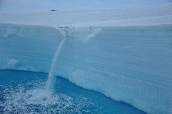 Meltwater waterfall at the Larsen A. ice shelf edge.