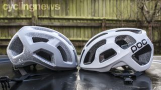 Two POC Ventral Lite helmets side by side, pointing towards each other