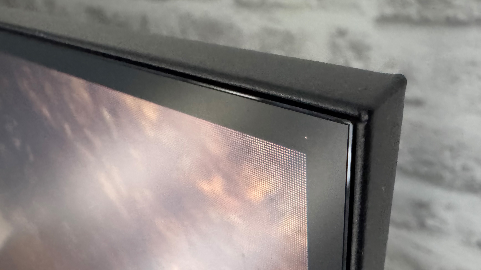 Metz MQE7600 4K TV close up of top right corner of set