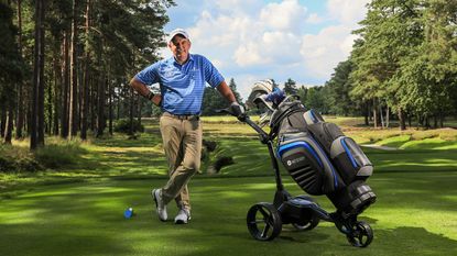 Paul McGinley poses with his trolley on the tee at Sunningdale Golf Club