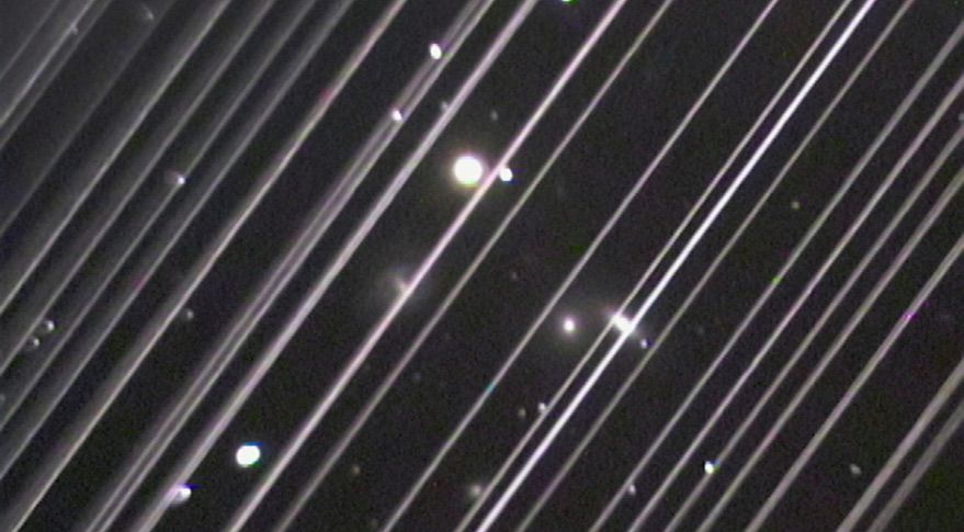 An image released by the IAU June 3 shows trails made by dozens of Starlink satellites as they passed through the field of view of a telescope during an observation shortly after launch. The IAU noted in its statement that the density and brightness of the satellites in this image is not representative of their appearance in their final orbital configuration.