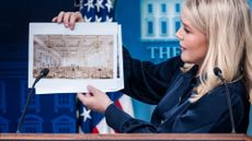 White House Press Secretary Karoline Leavitt holds up renderings of the proposed White House Ballroom during a press briefing
