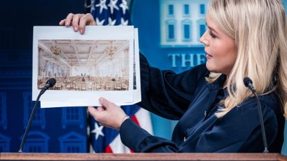 White House Press Secretary Karoline Leavitt holds up renderings of the proposed White House Ballroom during a press briefing