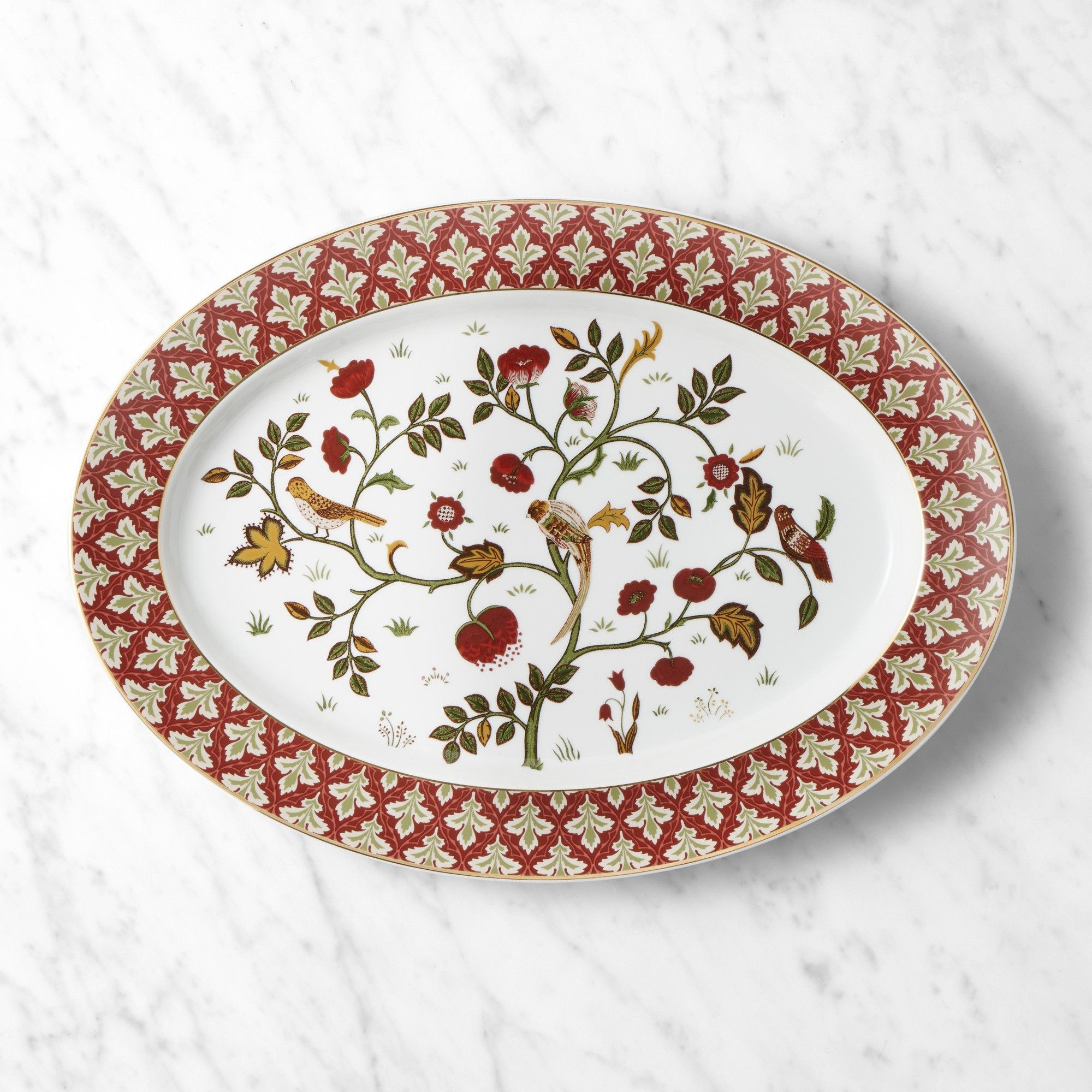 Oval platter with red and white leaf rim, botanical motif, and gold trim