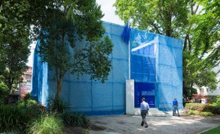 The Dutch Pavilion's new blue 'suit' hints at what's going on inside.