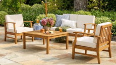 a patio scheme with a loveseat, two chairs, and a coffee table