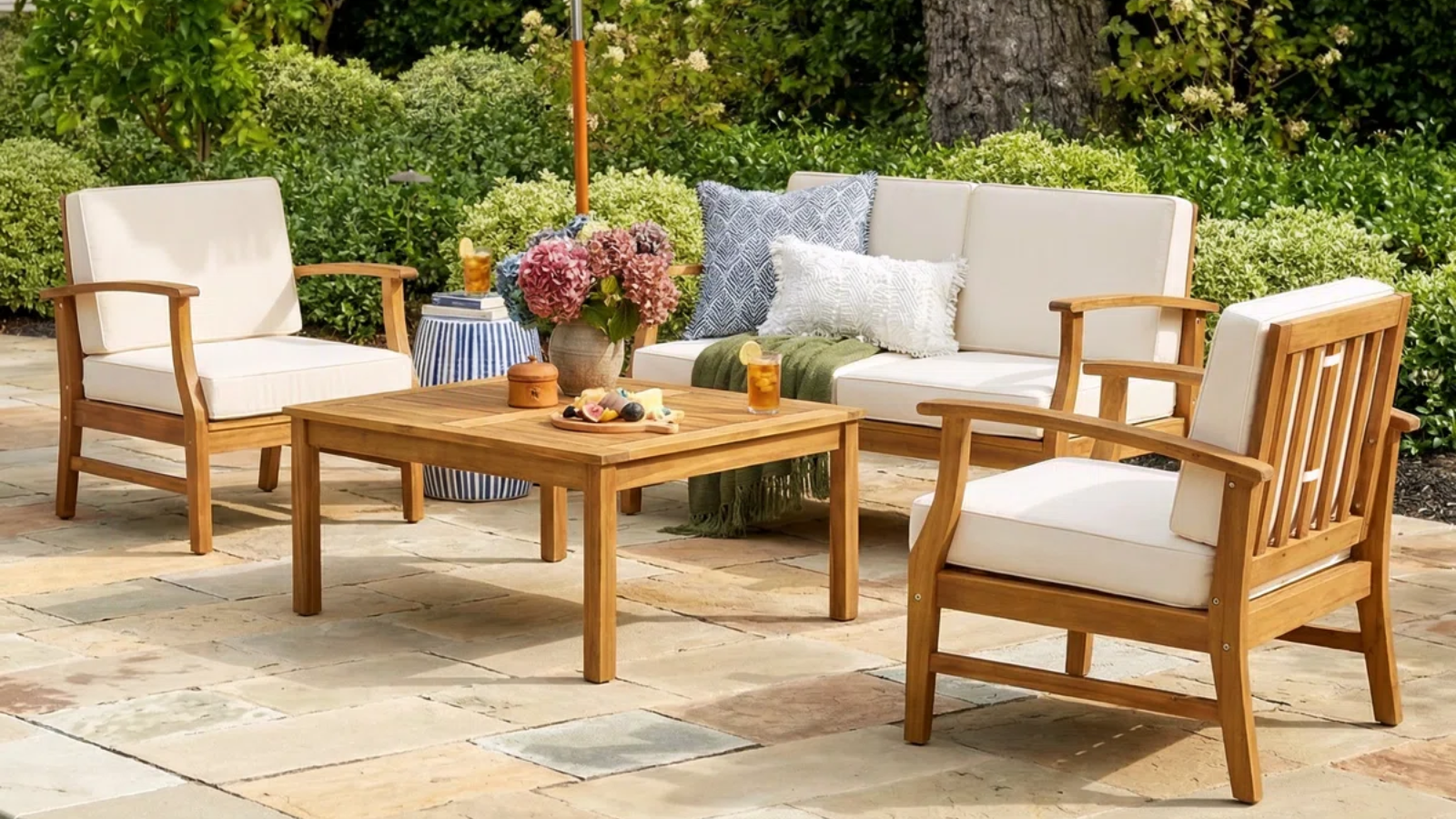 a patio scheme with a loveseat, two chairs, and a coffee table