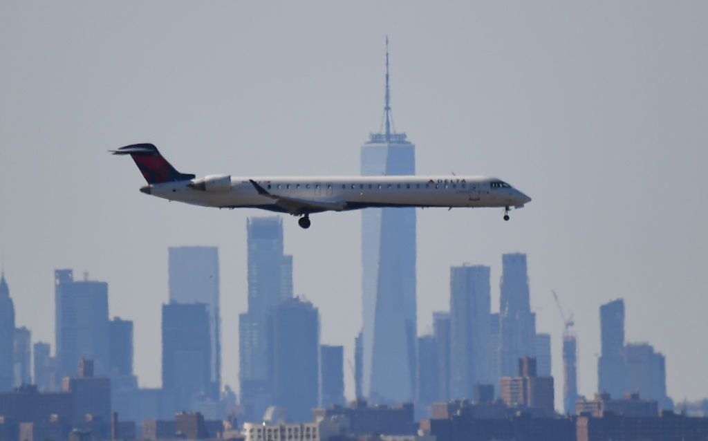 Plane flying over New York.