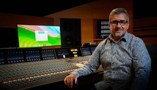 Headshot of Rick Naqvi in front of a mixer.