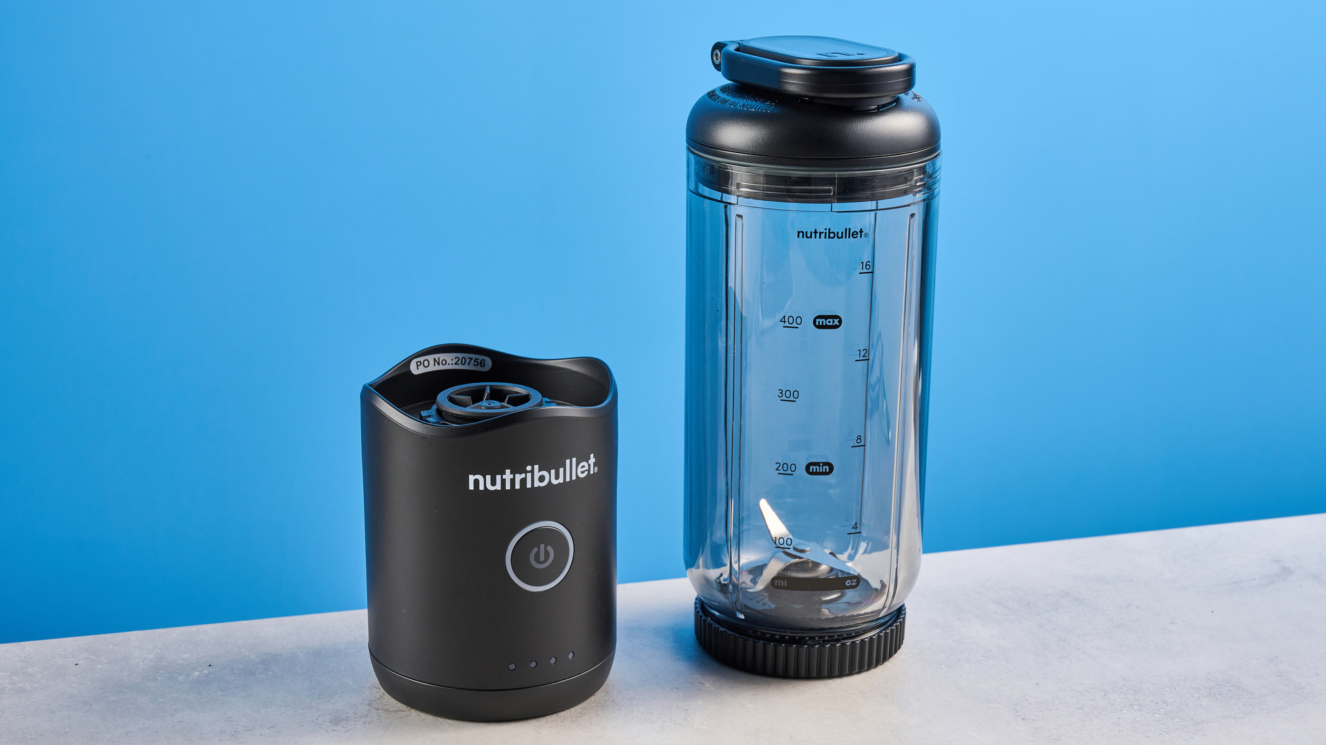 Nutribullet Flex blender photographed on a blue background