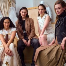 The stars of "Forbidden Fruit," Lola Tung, Lili Reinhart, Victoria Pedretti, and Alexandra Shipp, wearing Coach on the cover of the Who What Wear Spring Issue for 2026.