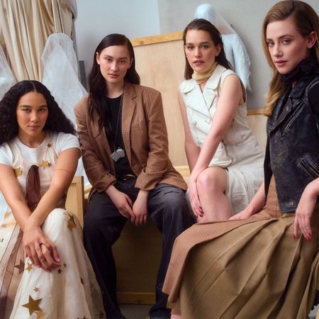 The stars of "Forbidden Fruit," Lola Tung, Lili Reinhart, Victoria Pedretti, and Alexandra Shipp, wearing Coach on the cover of the Who What Wear Spring Issue for 2026.