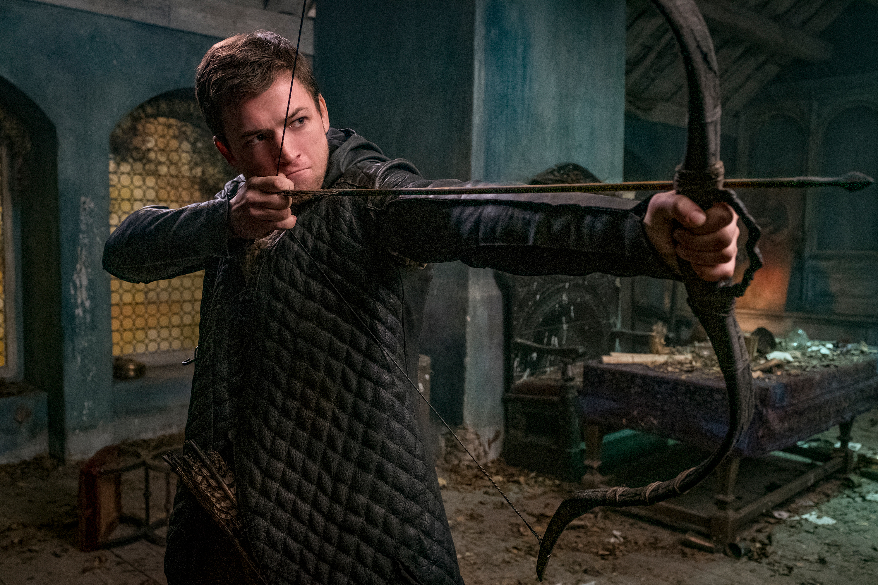 A man holds a bow and arrow in the Robin Hood TV shows