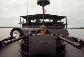 A US BPR gunner en route to Hue. Vietnam, 1968. | Location: southeast of Hue, Vietnam. (Photo by © Tim Page/CORBIS/Corbis via Getty Images)