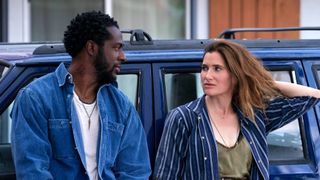 Danny Kincade (Quentin Plair) and Clare (Kathryn Hahn) talk in front of a car in Tiny Beautiful Things