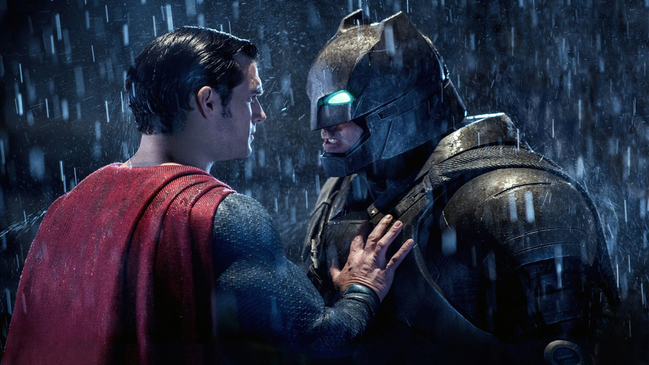 Superman puts his hand on an armored Batman's chest in DC's Batman v Superman movie