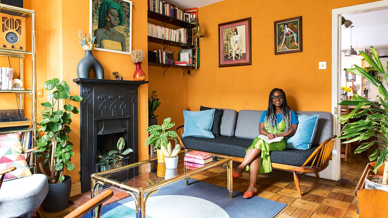 orange living room with home owner