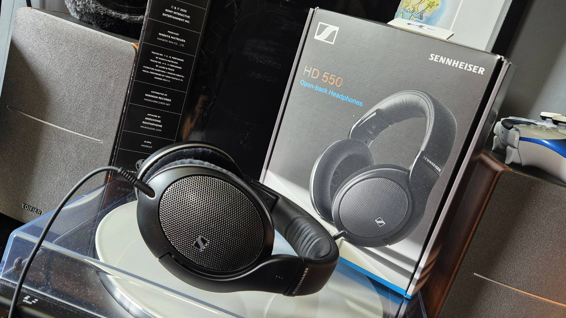 Photo of the Sennheiser HD 550's sitting on a record turntable, with their box in the background, taken by Rosalie Newcombe.