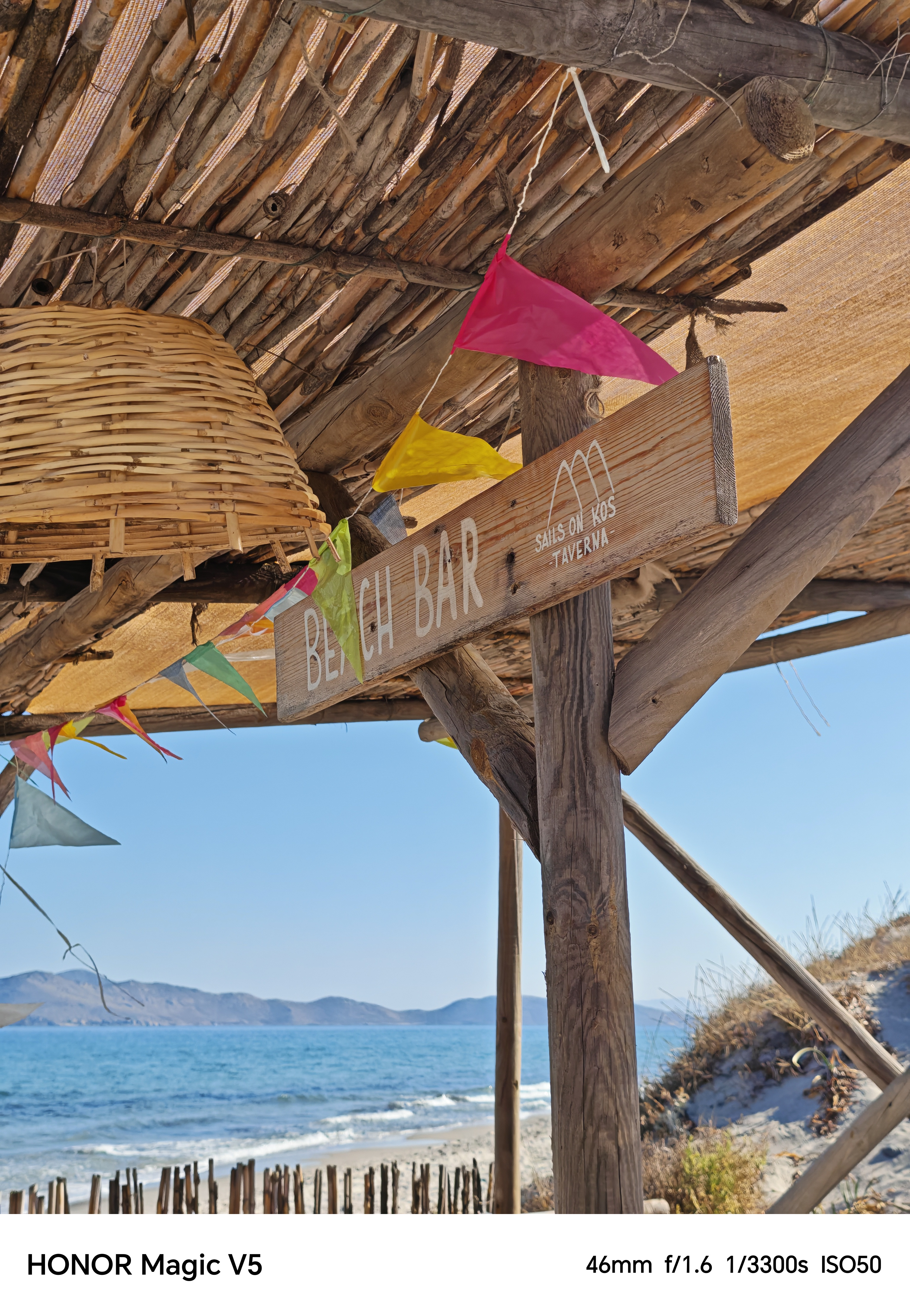 A wooden sign for a beach bar