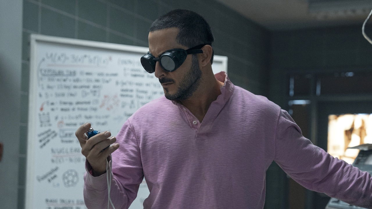 Frenchie wearing goggles looking at stopwatch in Fort Harmony in The Boys Season 5